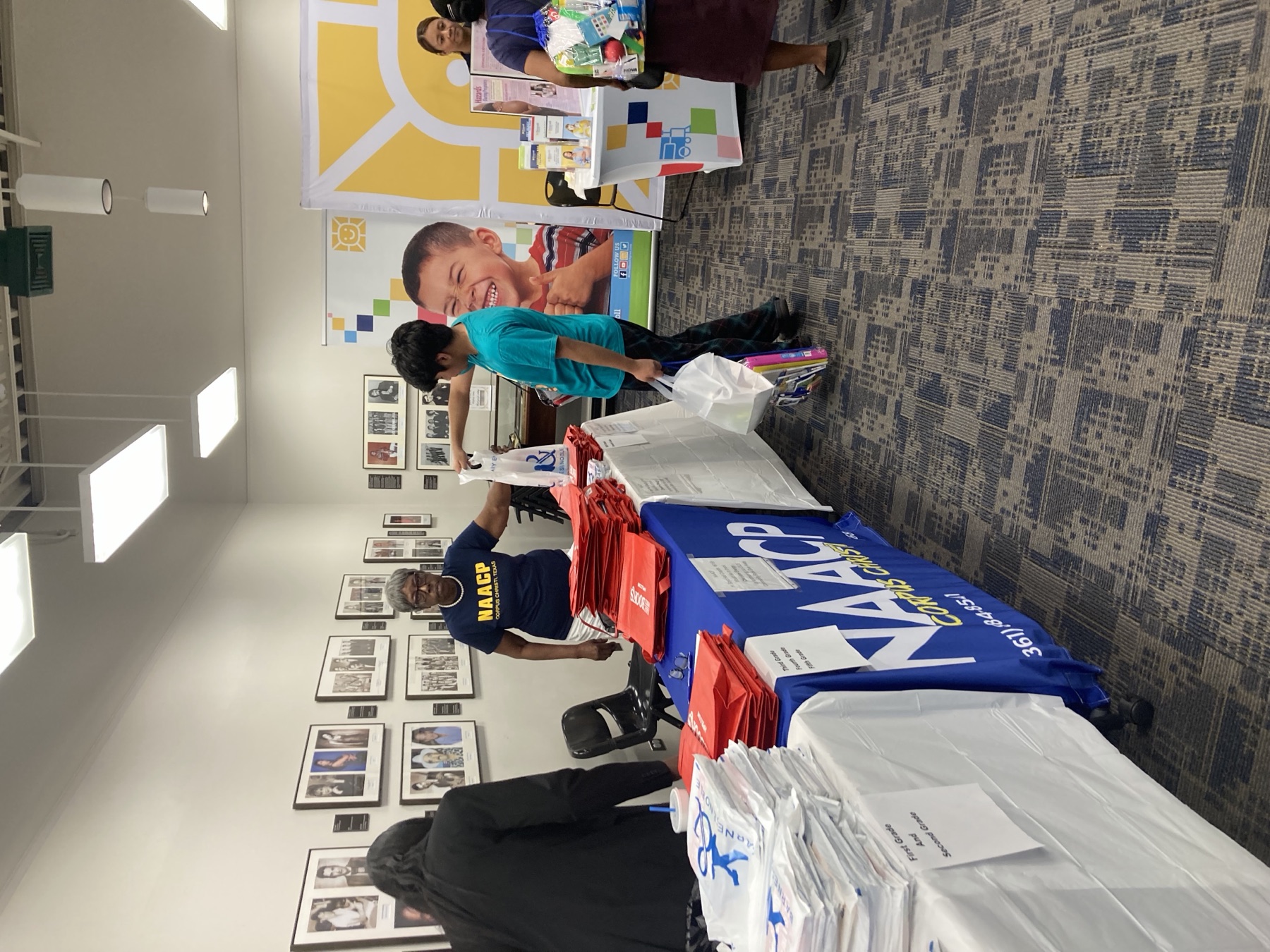 NAACP volunteers and community partners at a resource table