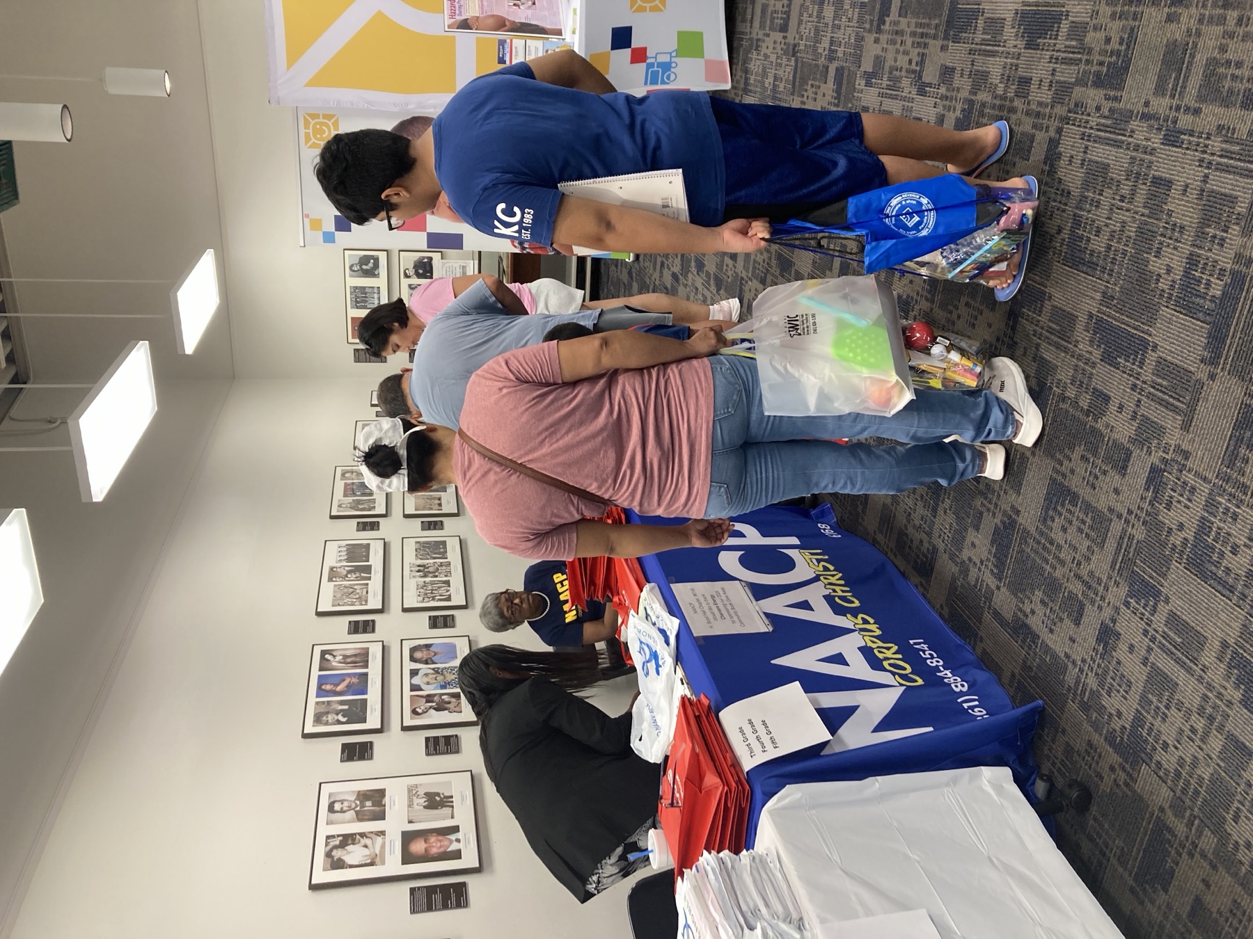 Community members gathered at the NAACP resource table